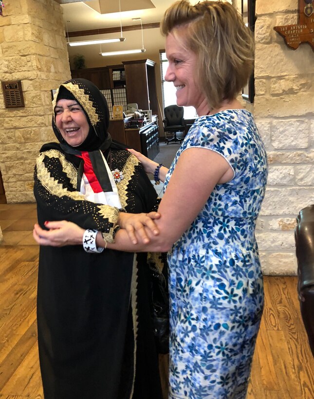 Paula Johnson welcomes Aliyah Khalaf Saleh, known as Umm Qusay in Iraq, to the Warrior and Family Support Center as part of the Iraqi humanitarian’s visit to Joint Base San Antonio-Fort Sam Houston.