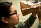 Senior Airman Evelyn Alvarado, 23d Aerospace Medicine Squadron meal, ready to eat (MRE) program manager, examines the inside of an MRE for holes during an MRE open-package inspection, April 6, 2018, at Moody Air Force Base, Ga. Airmen from Public Health examine the MREs for defects and overall quality and determine whether they’ll be utilized here, at other bases or to condemn the batch. Public Health monitors more than 8,400 MREs yearly to ensure they are safe and fit for consumption, so as to maintain a healthy fighting force. (U.S. Air Force photo by Airman 1st Class Erick Requadt)