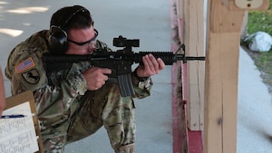 U.S. Army Sgt. 1st Class Scott Baranek fires an M4 carbine rifle during a weapons assembly and target range event that was part of U.S. Central Command’s Service Member of the Year (SMOY) competition. Baranek was announced as Senior SMOY during an awards ceremony April 6. (Photo by Tom Gagnier)