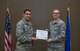Spring CCAF graduates receive diplomas during ceremony with 932nd Airlift Wing commander, Col. Raymond Smith.