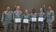 Spring CCAF graduates receive diplomas during ceremony with 932nd Airlift Wing commander, Col. Raymond Smith.