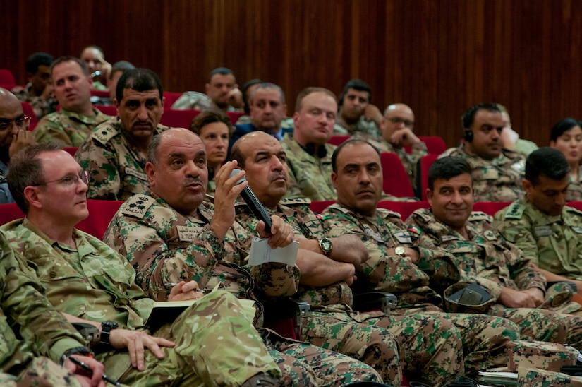 Jordan Armed Forces Brig. Gen. Dr. Yousef Alkhatib provides feedback to Jordanian officers during the capstone event of a NATO planning course near Amman, Jordan, April 4, 2018. Students in the course presented two potential courses of action in response to a simulated invasion and received feedback from senior NATO and Jordanian officers.