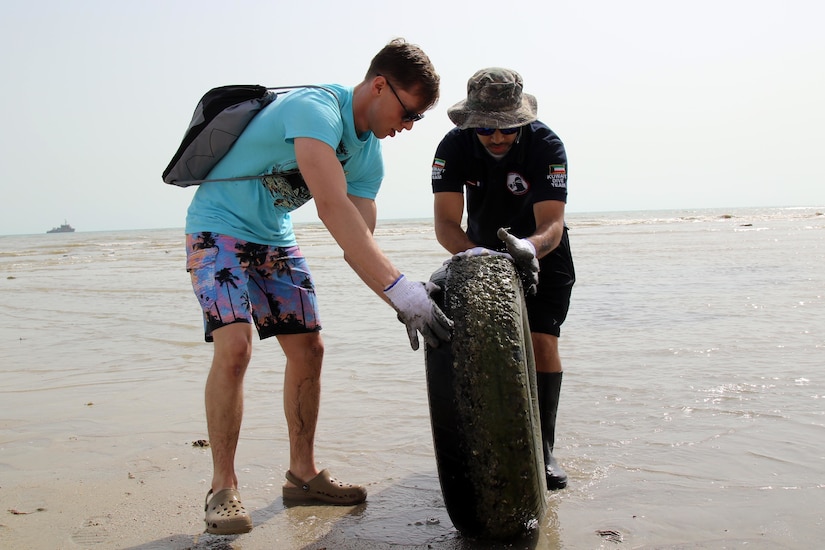 Task Force Spartan soldiers joined U.S. embassy staff, the Kuwait Dive Team and local citizens to conduct a cleanup of Anjafa Beach near Kuwait City on April 7, 2018.