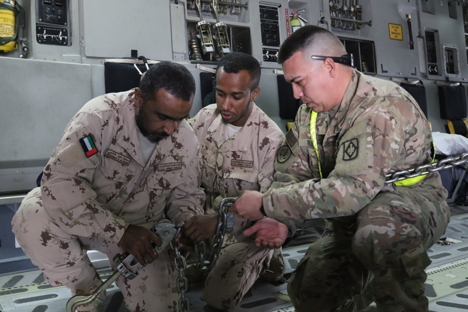 Soldiers of Alpha Battery, 2nd Battalion, 130th Field Artillery, 75th Field Artillery Brigade, 35th Infantry Division, from the Kansas National Guard, work with U.S. Air Force crew to load two M142 High Mobility Artillery Rocket Systems (HIMARS), pre-dawn, in preparation for the Operation Diamond Torrent exercise, at an airbase in the United Arab Emirates, Jan. 21. Operation Diamond Torrent demonstrated the capabilities of the C-17 and the HIMARS as an operational strategic strike package that can rapidly deploy and infiltrate to deliver a fast, flexible and lethal combination where ever needed.