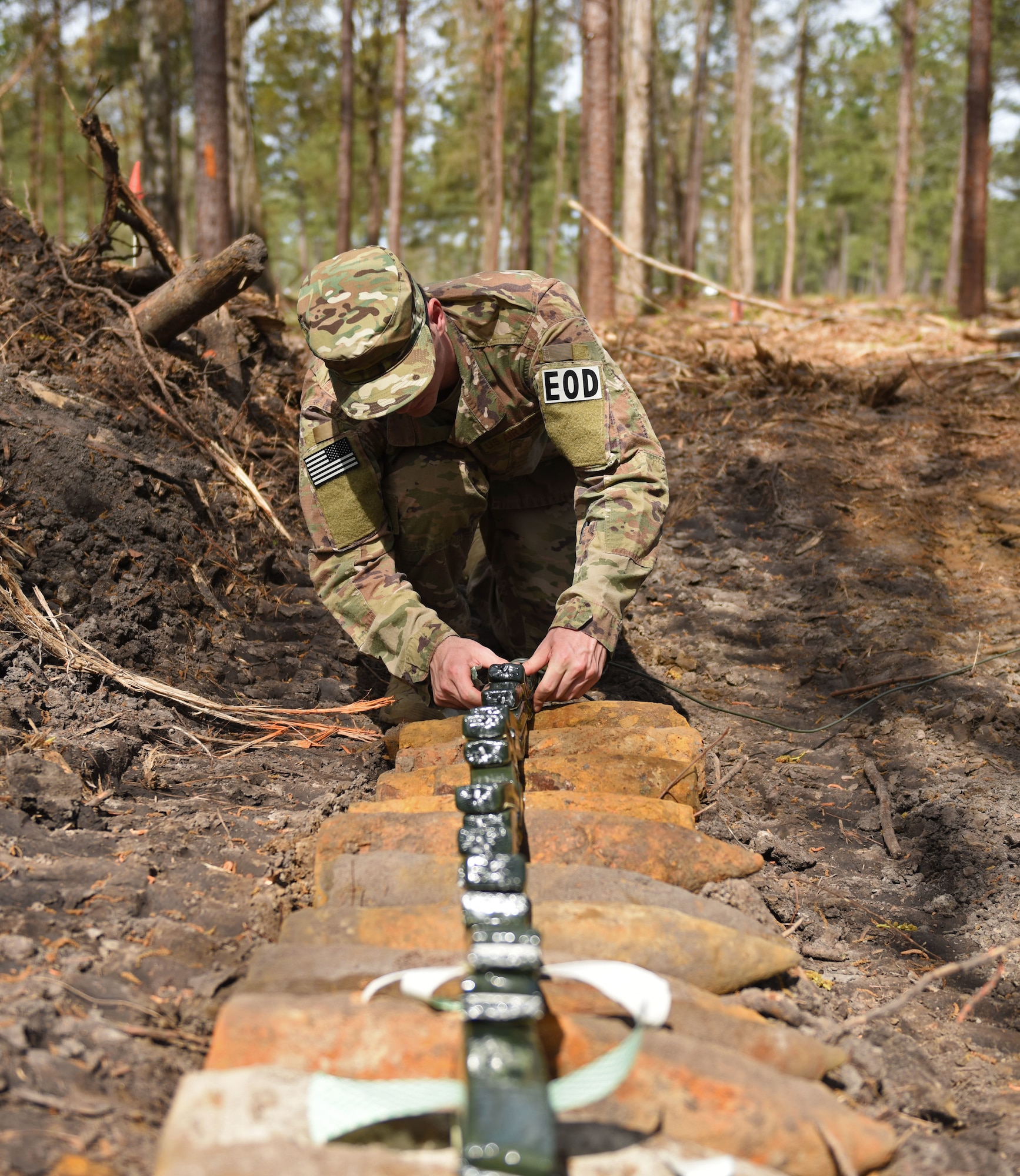 U.S. Air Force Airman 1st Class Zackary Stringer 20th Civil Engineer, explosive ordinance disposal apprentice is setting a "whipped" block of C4 in Conway, S.C., April 4.