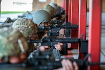 Students look down their sights as they fire M4 carbines during a Combat Arms Training and Maintenance (CATM) class, April 3, 2018, at Moody Air Force Base, Ga. Airmen must demonstrate quality safety standards while handling and shooting their weapons proficiently in order to be eligible to deploy. Throughout the class the instructors emphasized: weapon handling techniques, proper sight usage and internal weapon cleaning procedures. (U.S. Air Force photo by Airman Eugene Oliver)