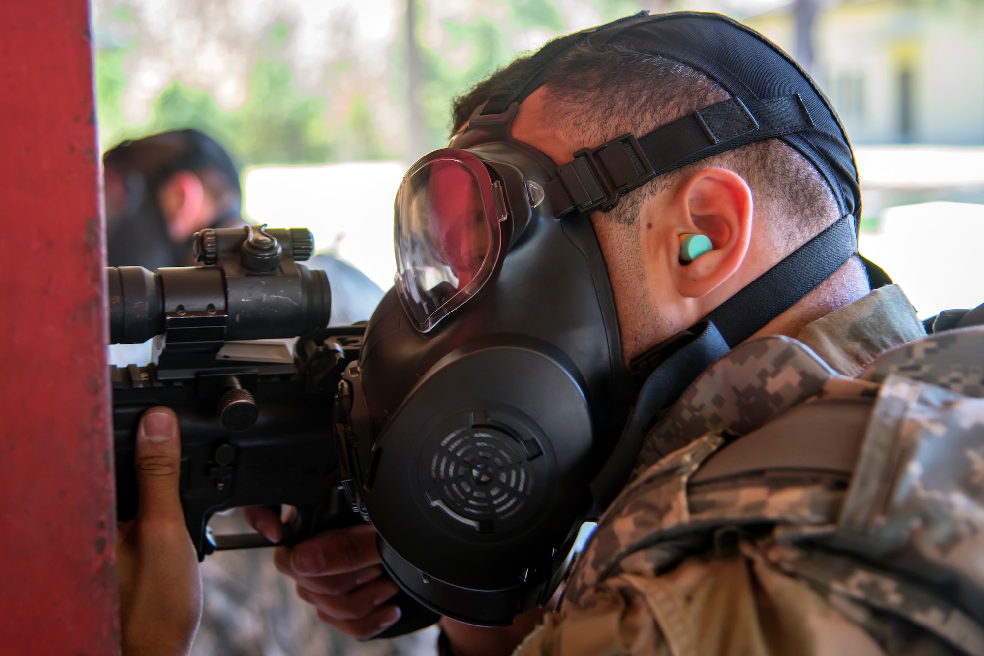 An Airman from the 23d Maintenance Group aims down the sight of a M4 carbine during a Combat Arms Training and Maintenance (CATM) class, April 3, 2018, at Moody Air Force Base, Ga. Airmen must demonstrate quality safety standards while handling and shooting their weapons proficiently in order to be eligible to deploy. Throughout the class the instructors emphasized: weapon handling techniques, proper sight usage and internal weapon cleaning procedures.	 (U.S. Air Force photo by Airman Eugene Oliver)