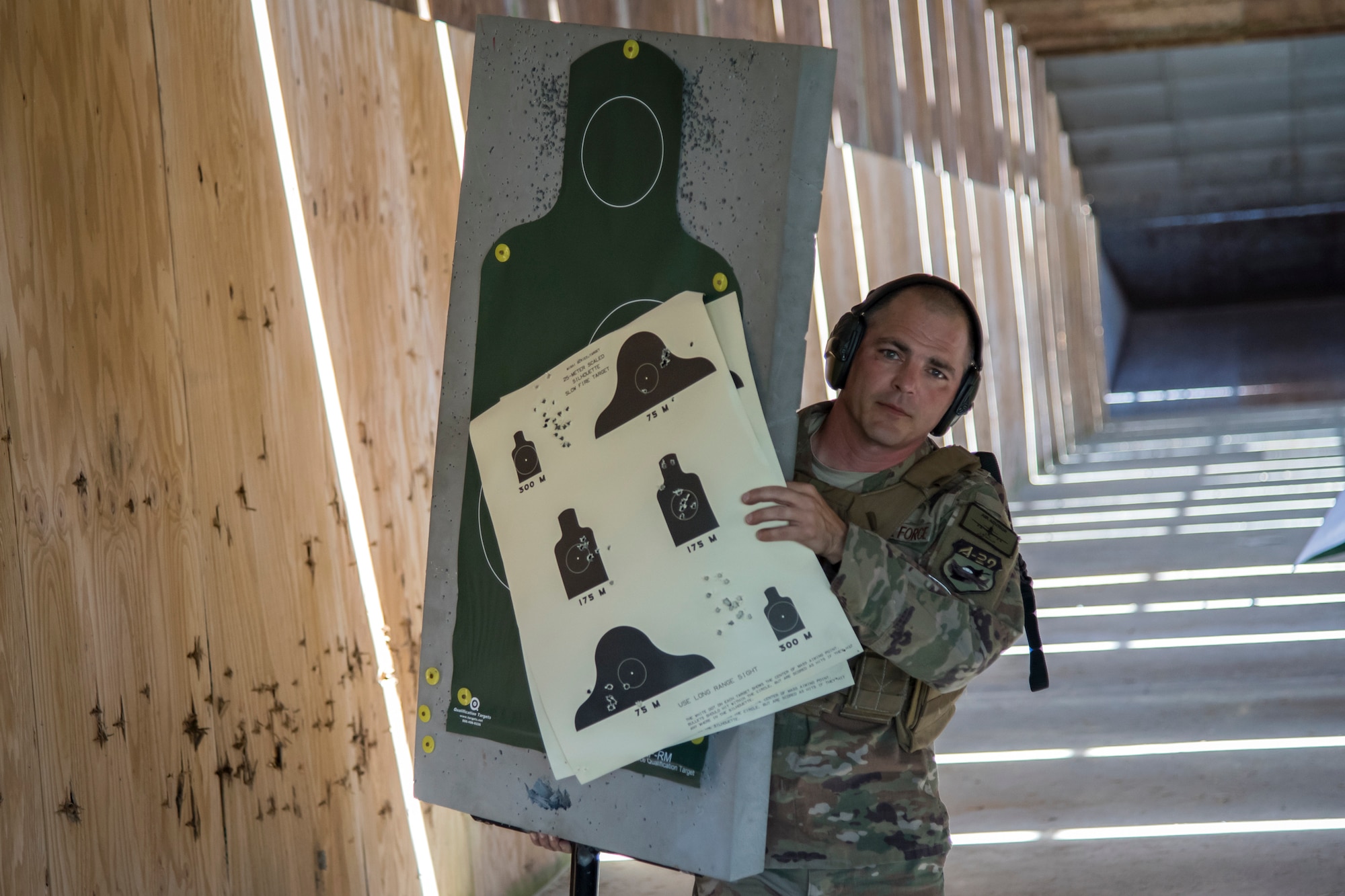 Master Sgt. Mickey Barton, 81st Fighter Squadron weapons air advisor, carries his target sheet during a Combat Arms Training and Maintenance (CATM) class, April 3, 2018, at Moody Air Force Base, Ga. Airmen must demonstrate quality safety standards while handling and shooting their weapons proficiently in order to be eligible to deploy. Throughout the class the instructors emphasized: weapon handling techniques, proper sight usage and internal weapon cleaning procedures.   (U.S. Air Force photo by Airman Eugene Oliver)