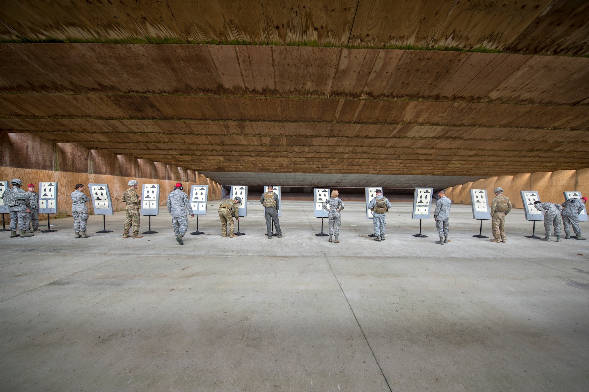 Airmen scrutinize their target sheets during a Combat Arms Training and Maintenance (CATM) class, April 4, 2018, at Moody Air Force Base, Ga.  Airmen must demonstrate quality safety standards while handling and shooting their weapons proficiently in order to be eligible to deploy. Throughout the class the instructors emphasized: weapon handling techniques, proper sight usage and internal weapon cleaning procedures.  (U.S. Air Force photo by Airman Eugene Oliver)