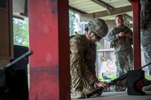 An Airman from the 19th Air Support Operations Squadron places an M4 carbine on the ground during a Combat Arms Training and Maintenance (CATM) class, April 4, 2018, at Moody Air Force Base, Ga. Airmen must demonstrate quality safety standards while handling and shooting their weapons proficiently in order to be eligible to deploy. Throughout the class the instructors emphasized: weapon handling techniques, proper sight usage and internal weapon cleaning procedures. (U.S. Air Force photo by Airman Eugene Oliver)