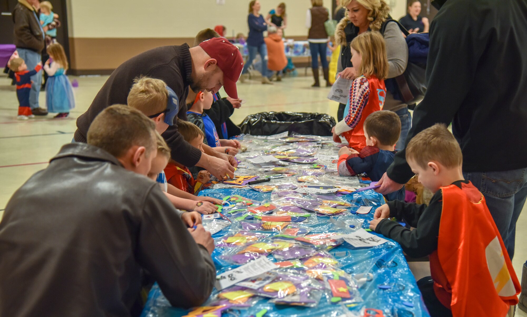 South Dakota National Guard members and their kids creates different masks during the Princess and Super Hero Day Camp April 7, 2018, at the National Guard Armory, Sioux Falls, S.D.