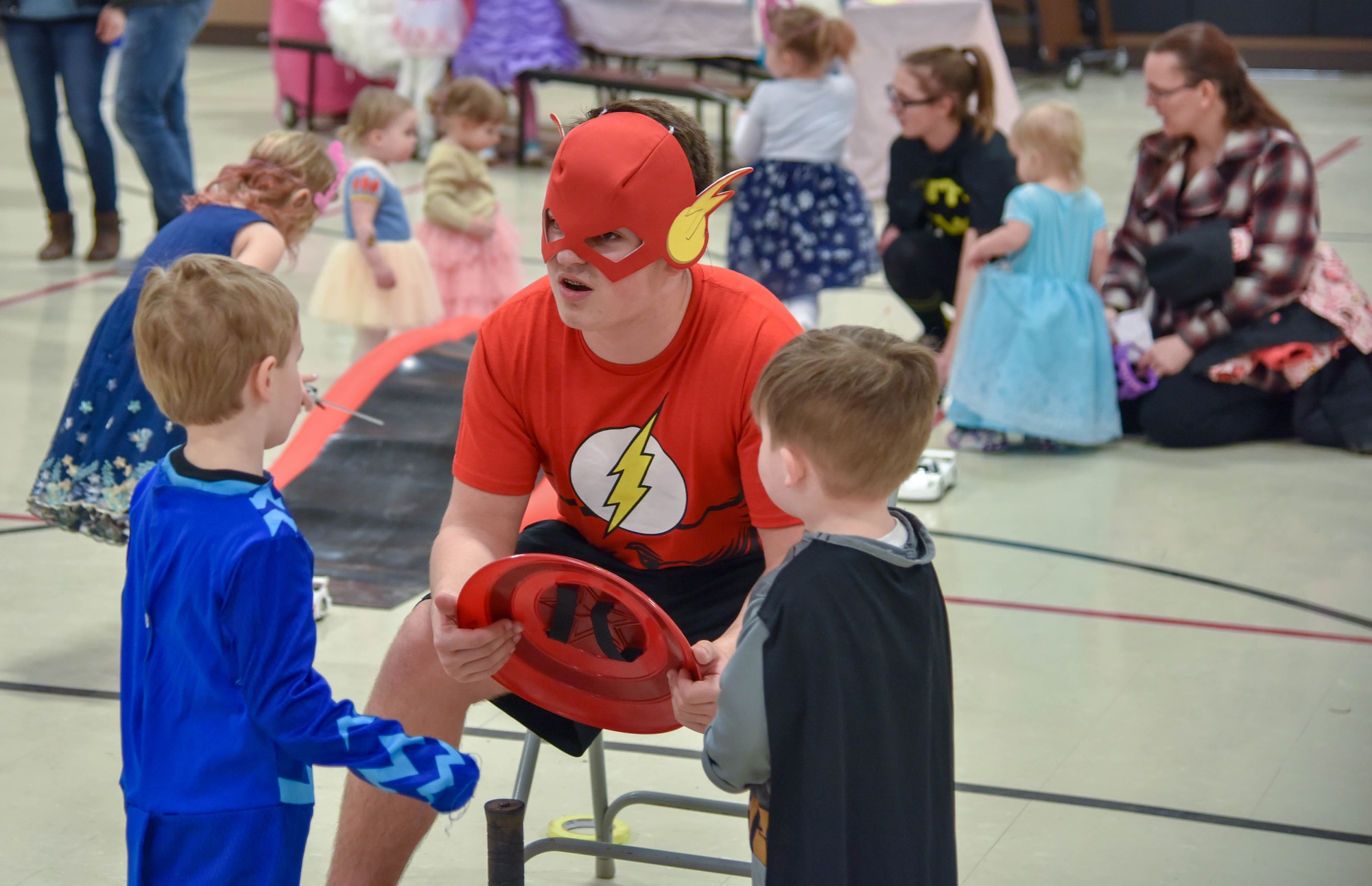 Brayden Frey, South Dakota National Guard Youth Council member, dressed up as the super hero Flash chats with kids during the Princess and Super Hero Day Camp April 7, 2018, at the National Guard Armory, Sioux Falls, S.D.