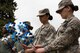 Team Fairchild Airmen hold pinwheels while attending a base pinwheel ceremony in honor of Child Abuse Awareness Month at Fairchild Air Force Base, Washington, April 9, 2018. The pinwheel in action not only catches the eye of both children and adults, but more importantly, it represents the whimsical and carefree childhood every child deserves. (U.S. Air Force photo/Senior Airman Ryan Lackey)