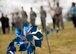 A pinwheel twirls in the wind on the chapel lawn during a pinwheel ceremony in honor of Child Abuse Awareness Month at Fairchild Air Force Base, Washington, April 9, 2018. Airmen placed  pinwheels at the base chapel to honor Child Abuse Awareness Month. (U.S. Air Force photo/Senior Airman Ryan Lackey)