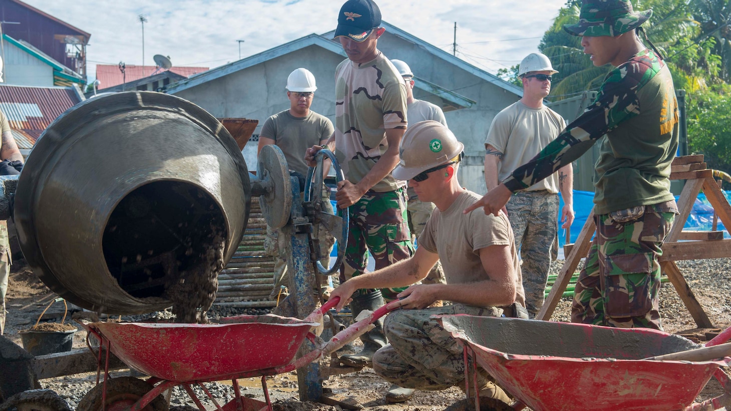 BENGKULU, Indonesia (March 30, 2018) Joint service members pour motor alongside Tentara National Indonesia service members at a community hall construction site during a Pacific Partnership 2018 (PP18).  PP18Õs mission is to work collectively with host and partner nations to enhance regional interoperability and disaster response capabilities, increase stability and security in the region, and foster new and enduring friendships across the Indo-Pacific Region. Pacific Partnership, now in its 13th iteration, is the largest annual multinational humanitarian assistance and disaster relief preparedness mission conducted in the Indo-Pacific. (U.S. Navy photo by Mass Communication Specialist 3rd Class Cameron Pinske/Released)