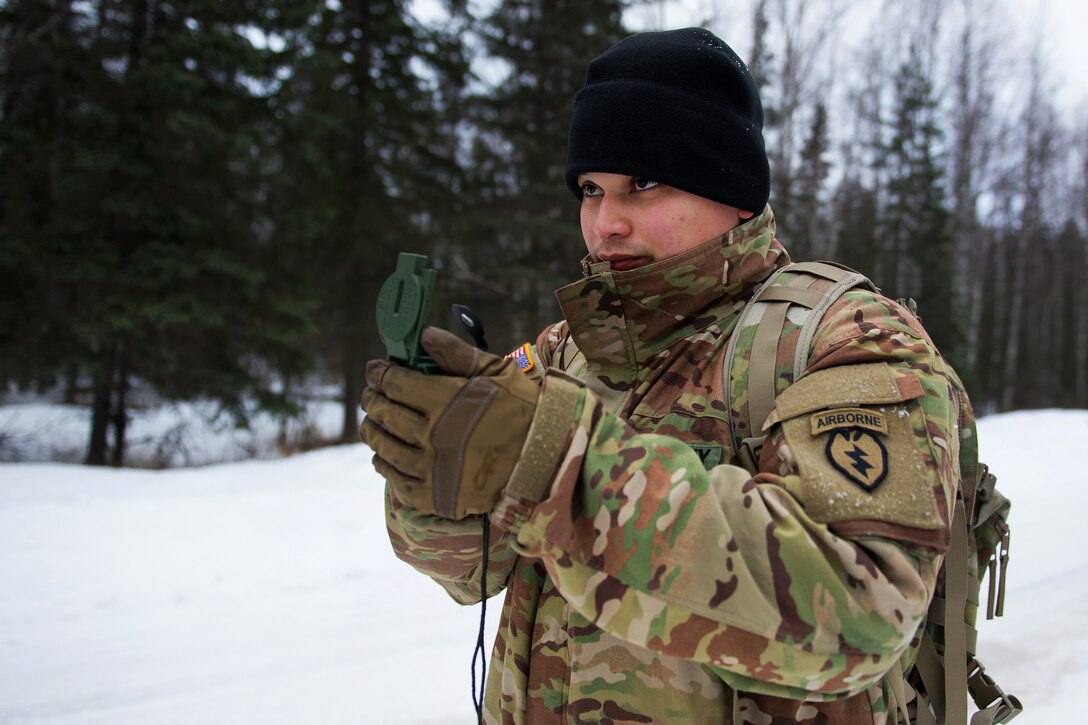 A soldier plots his next point during land navigation training.