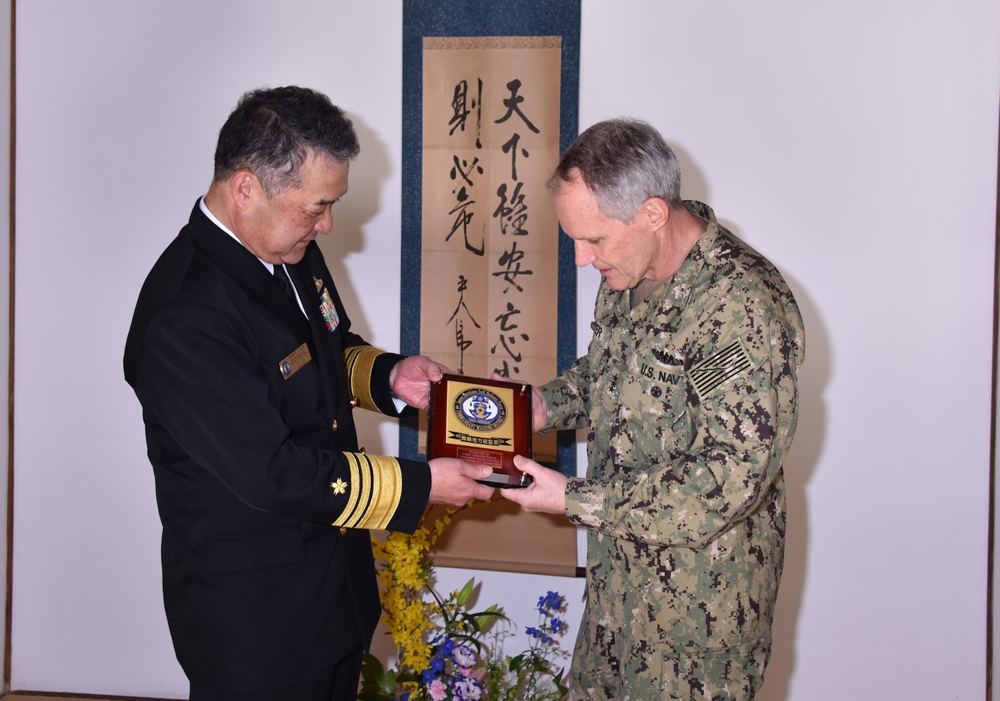 KYOTO, Japan (April 10, 2018) Vice. Adm. Phil Sawyer, commander, U.S. 7th Fleet, right, accepts a gift from Japan Maritime Self-Defense Force (JMSDF) Vice Adm. Takehisa Nakao, commandant of the JMSDF Maizuru District, during a visit to the Maizuru District headquarters in Kyoto. Sawyer visited Kyoto to reinforce 7th Fleet’s close, long-standing partnership with the JMSDF throughout Japan.