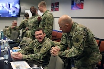 Soldiers talking at meeting