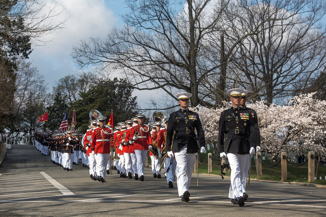 Marines with Marine Barracks Washington D.C. escort the remains of Maj. Gen. John A. Studds during a full honors funeral at Arlington National Cemetery, Arlington, Virginia, April 10, 2018. General Studds was commissioned into the Marine Corps in 1960 and served the following 33 years as an Infantry Officer. He commanded Marines at all levels including; Commander, Charlie Company, 3rd Reconnaissance Battalion in Vietnam where he received the Bronze Star with Combat "V" for valor and was the Director of Marine Corps Intelligence during Operations Desert Shield and Desert Storm. Studds concluded his devout career as the Commanding General, Marine Corps Recruit Depot, San Diego. (Official U.S. Marine Corps photo by Sgt. Robert Knapp/Released)