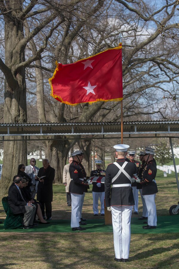 Marine Corps Body Bearers with Bravo Company, Marine Barracks Washington D.C., prepare to fold the National Flag during a full honors funeral for Maj. Gen. John A. Studds at Arlington National Cemetery, Arlington, Virginia, April 10, 2018. General Studds was commissioned into the Marine Corps in 1960 and served the following 33 years as an Infantry Officer. He commanded Marines at all levels including; Commander, Charlie Company, 3rd Reconnaissance Battalion in Vietnam where he received the Bronze Star with Combat "V" for valor and was the Director of Marine Corps Intelligence during Operations Desert Shield and Desert Storm. Studds concluded his devout career as the Commanding General, Marine Corps Recruit Depot, San Diego. (Official U.S. Marine Corps photo by Sgt. Robert Knapp/Released)