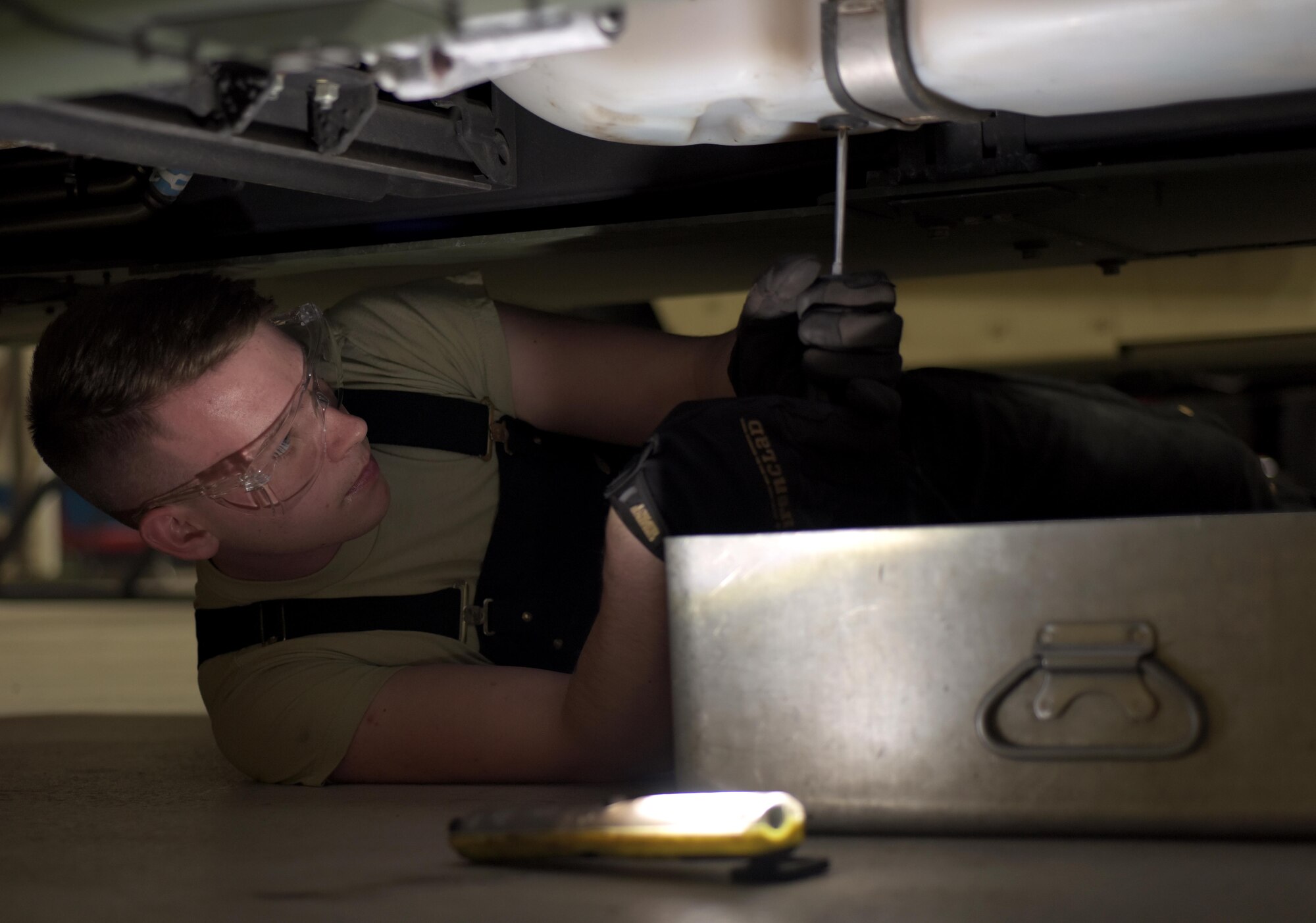 U.S. Air Force Airman 1st Class Joshua Patterson, 100th Logistics Readiness Squadron mission generating vehicular maintenance journeyman, prepares to empty the fuel tank of a Humvee at RAF Mildenhall, England, April 4, 2018. Vehicle maintenance teaches Airmen to develop troubleshooting and critical thinking skills to help them do their job. (U.S. Air Force photo by Airman 1st Class Benjamin Cooper)
