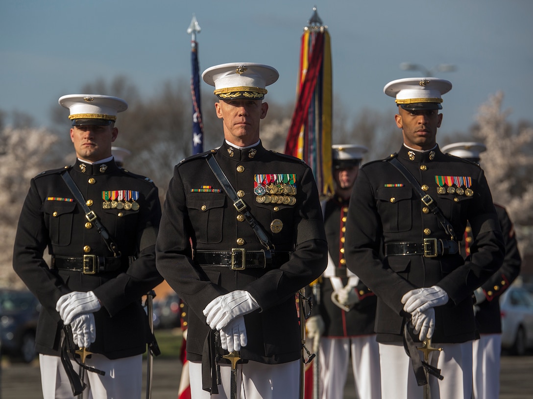 Colonel Tyler J. Zagurski, center, commanding officer, Marine Barracks Washington D.C., Capt. Logan A. Giger, left, infantry officer, MBW, and Capt. Ryan Davis, logistics officer, MBW, stand at a ceremonial position during a full honors funeral for Maj. Gen. John A. Studds at Arlington National Cemetery, Arlington, Virginia, April 10, 2018. General Studds was commissioned into the Marine Corps in 1960 and served the following 33 years as an Infantry Officer. He commanded Marines at all levels including; Commander, Charlie Company, 3rd Reconnaissance Battalion in Vietnam where he received the Bronze Star with Combat "V" for valor and was the Director of Marine Corps Intelligence during Operations Desert Shield and Desert Storm. Studds concluded his devout career as the Commanding General, Marine Corps Recruit Depot, San Diego.