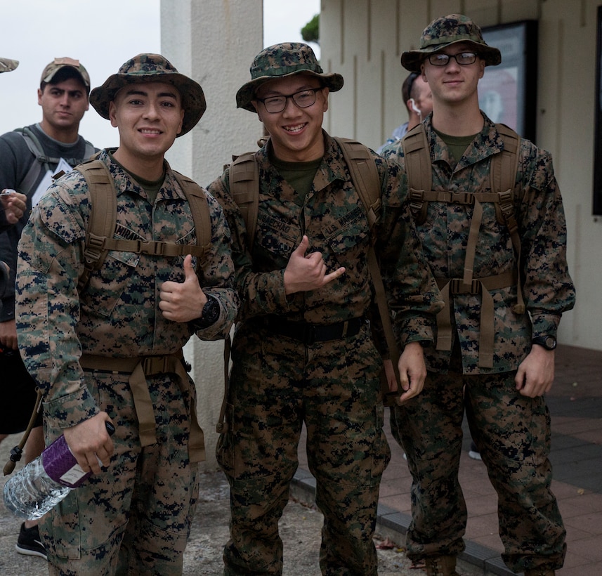 Marines wait to sign into the Bataan Death March Memorial hike, April 7, 2018 on Kadena Air Force base, Okinawa, Japan. More than 200 service members and their families participated in the 8.5 mile hike around Kadena’s perimeter in remembrance of the prisoners of war who perished as a result of the Death March that took place in the Philippine archipelago in 1942 during WWII.