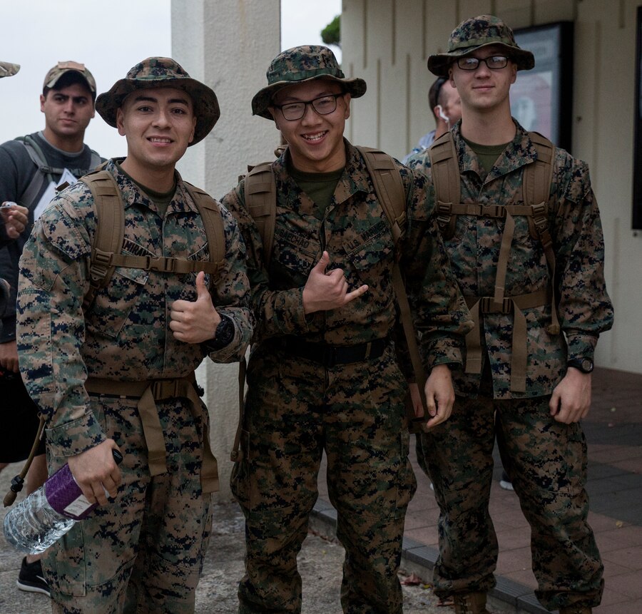 Marines wait to sign into the Bataan Death March Memorial hike, April 7, 2018 on Kadena Air Force base, Okinawa, Japan. More than 200 service members and their families participated in the 8.5 mile hike around Kadena’s perimeter in remembrance of the prisoners of war who perished as a result of the Death March that took place in the Philippine archipelago in 1942 during WWII.