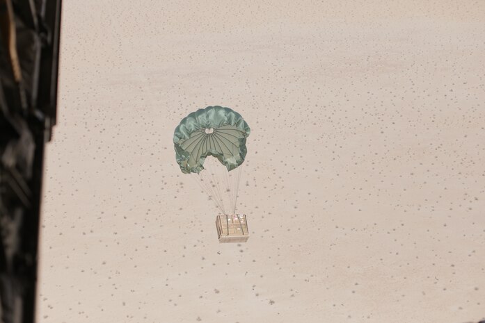 Units of blood descend from the sky during an air delivery drop at Marine Corps Air Station Yuma, Ariz., March 28, 2018. The training was conducted to test new delivery methods for units of blood to units who are deployed to austere environments.