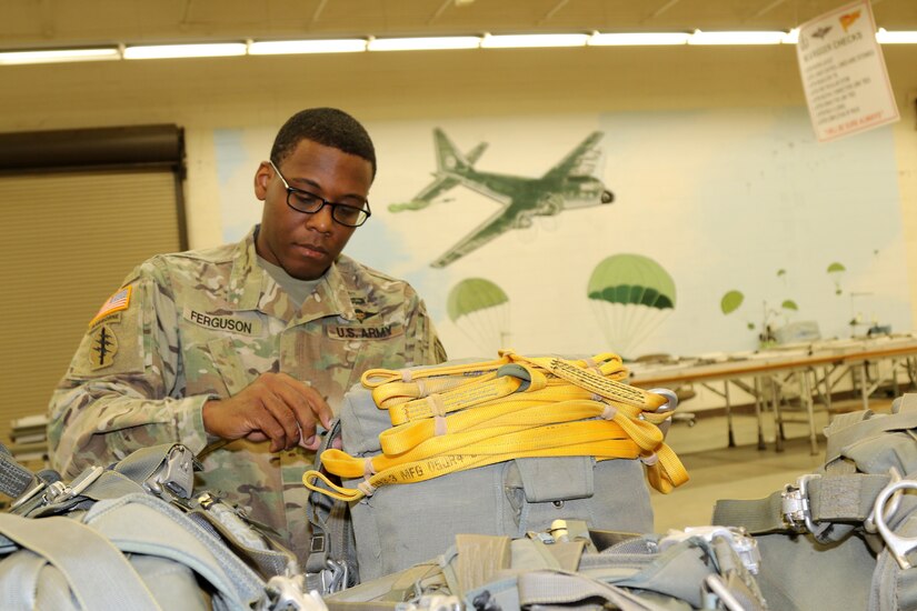 Parachute riggers focused on providing safe landings