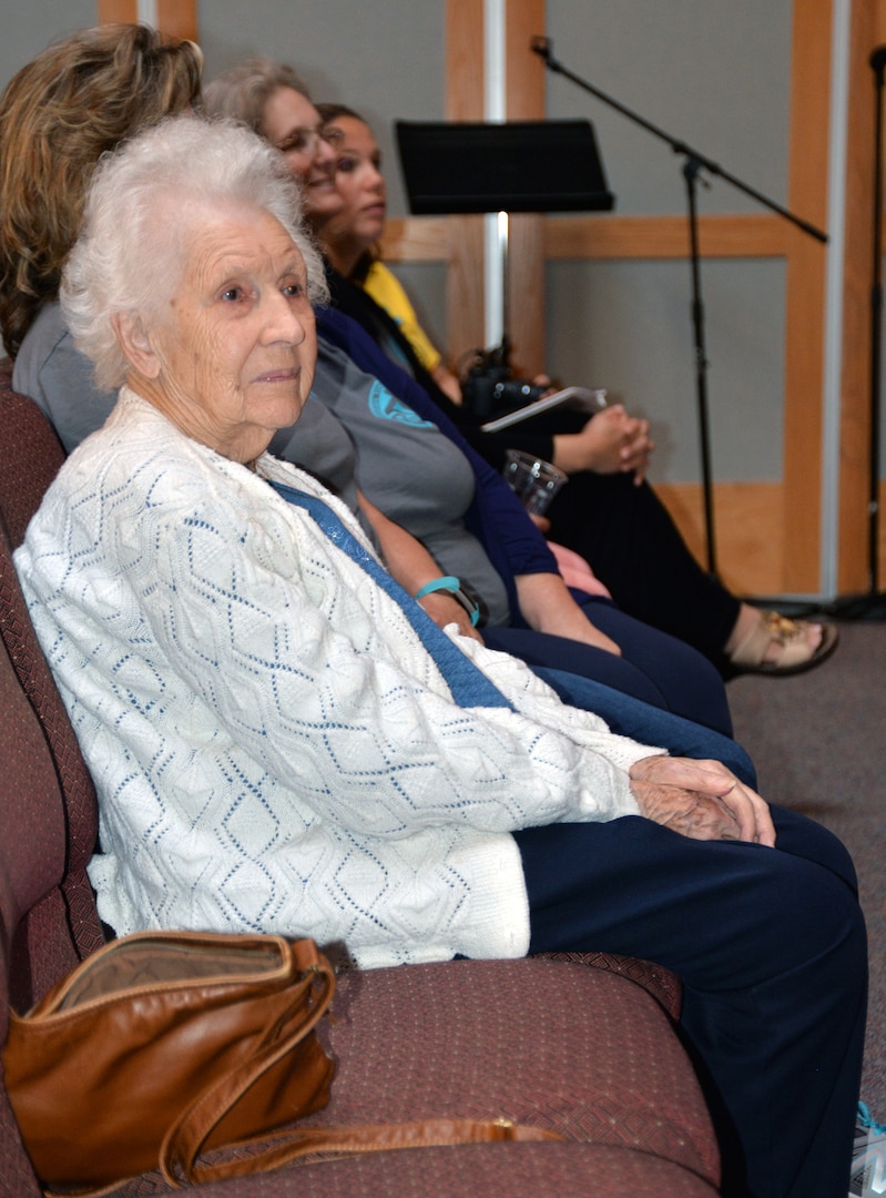 Betty Beard (right) listens as her time in the Women's Army Corp is discussed during her 100th birthday celebration at the Dodd Field Chapel at Joint Base San Antonio-Fort Sam Houston April 11. Beard served during World War II and achieved the rank of technical sergeant, as well as meeting her husband while in the WAC. The Protestant Women of the Chapel threw the birthday bash for the new centenarian.