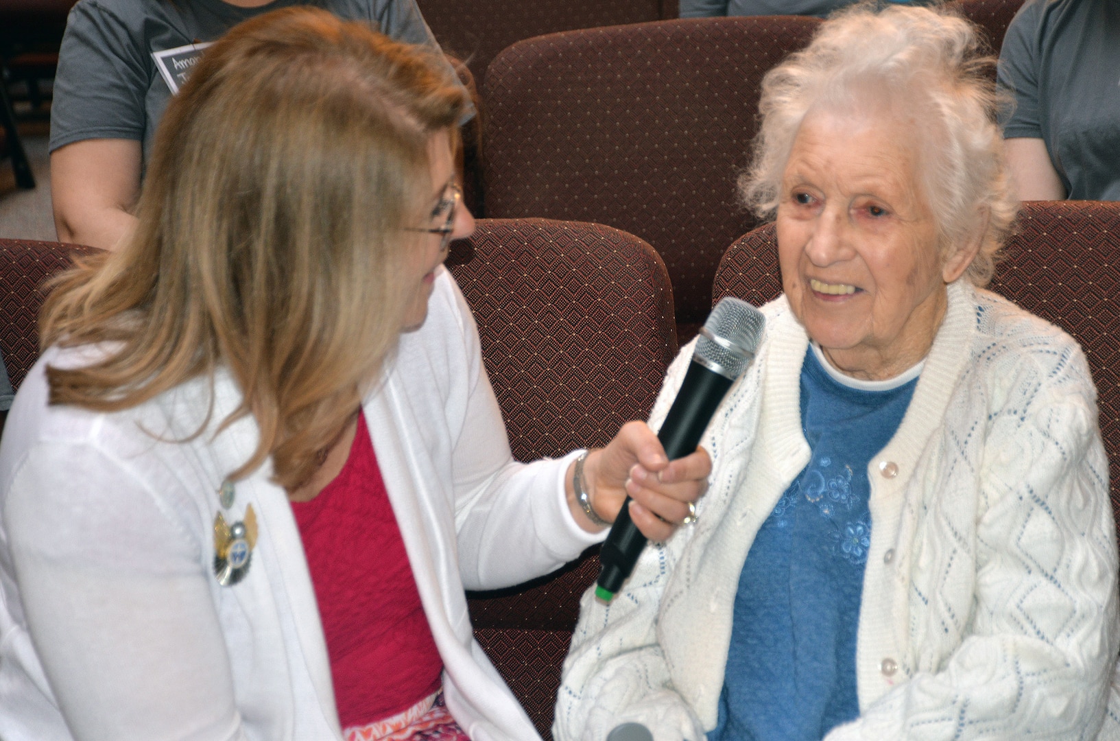 Betty Beard (right) speaks about her time in the Women's Army Corp during her 100th birthday celebration at the Dodd Field Chapel at Joint Base San Antonio-Fort Sam Houston April 11. Beard served during World War II and achieved the rank of technical sergeant, as well as meeting her husband while in the WAC. The Protestant Women of the Chapel threw the birthday bash for the new centenarian.