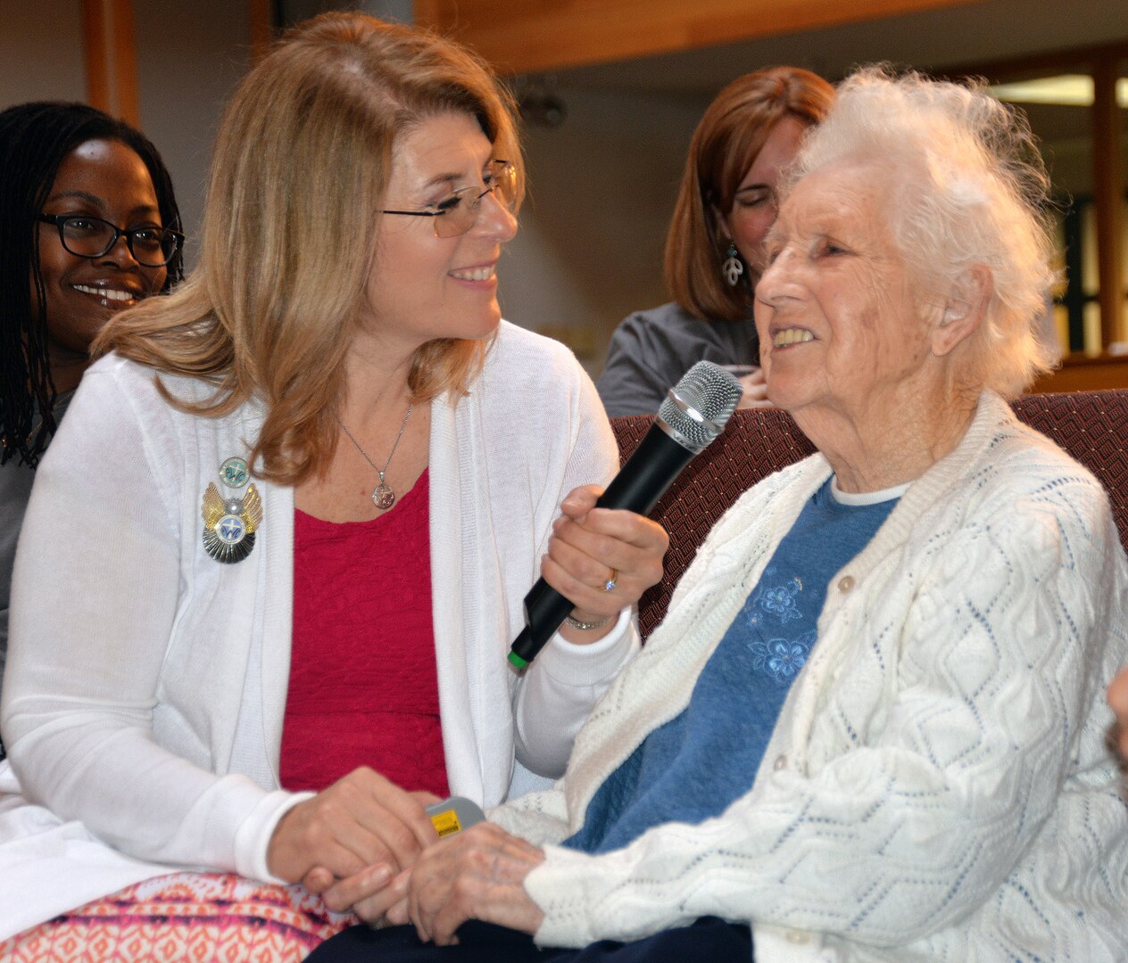 Betty Beard (right) speaks about her time in the Women's Army Corp during her 100th birthday celebration at the Dodd Field Chapel at Joint Base San Antonio-Fort Sam Houston April 11. Beard served during World War II and achieved the rank of technical sergeant, as well as meeting her husband while in the WAC. The Protestant Women of the Chapel threw the birthday bash for the new centenarian.