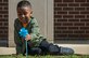 Jordan Milana, age 4, son of U.S. Navy Petty Officer 3rd Class Monique Smith, Naval Portsmouth Hospital aviation boatswain's mate, plants a pinwheel at the Russ Child Development Center annex at Joint Base Langley-Eustis, Va., April 2, 2018.