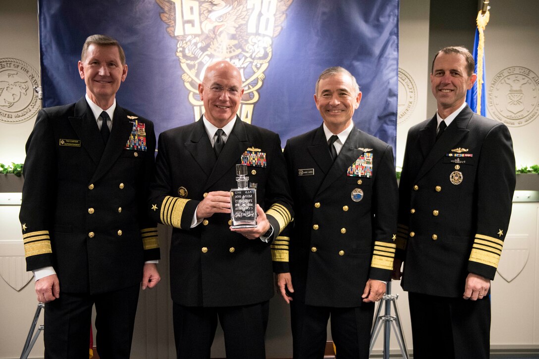 Navy leaders pose for a photo.