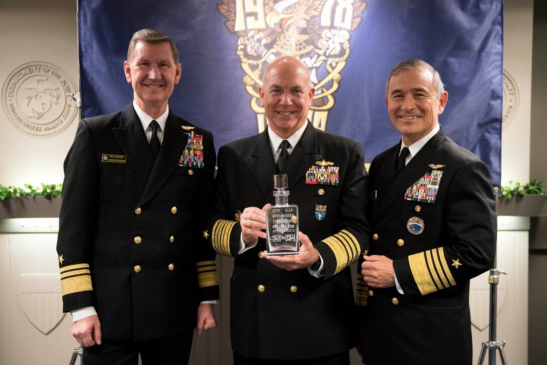 Navy leaders pose for a photo.