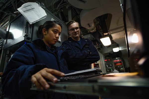 Information Systems Technicians monitor communication systems aboard USS Theodore Roosevelt, January 2018, Arabian Gulf (U.S. Navy/Alex Corona)