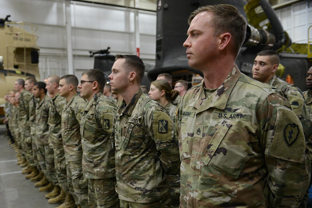 U.S. Army Soldiers from the 128th Aviation Brigade stand in formation during a visit from Ultimate Fighting Championship fighters and radio hosts at Joint Base Langley-Eustis, Va., April 5, 2018.