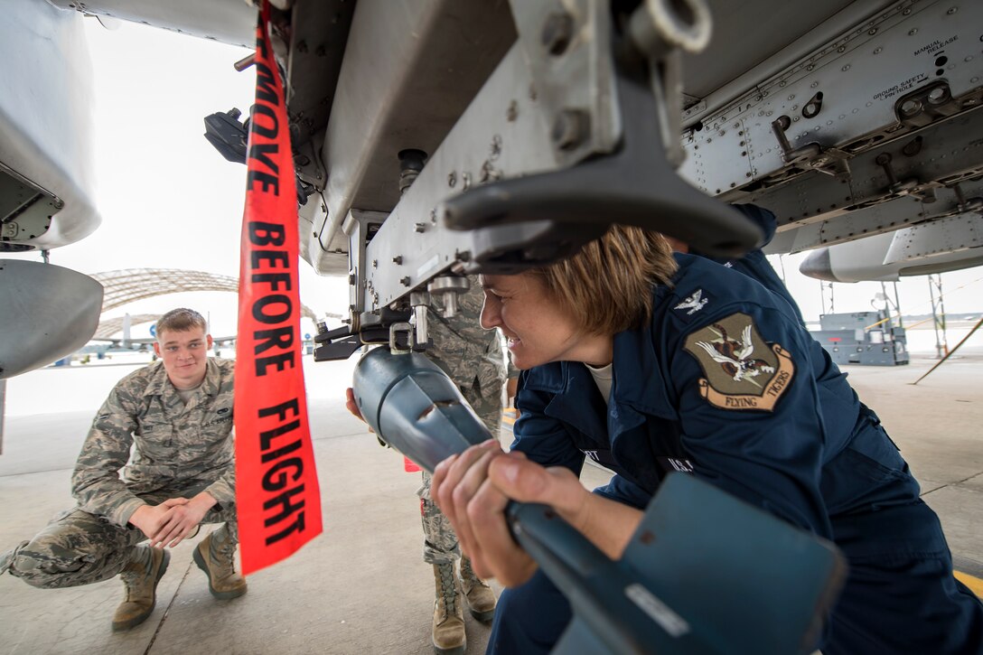 Col. Jennifer Short, right, 23d Wing commander, attempts to install a training munition onto an A-10C Thunderbolt II during an immersion tour, April 9, 2018, at Moody Air Force Base, Ga.  Moody’s leadership toured the 23d Aircraft Maintenance Squadron to get a better understanding of their overall mission, capabilities, and comprehensive duties. (U.S. Air Force photo by Airman Eugene Oliver)