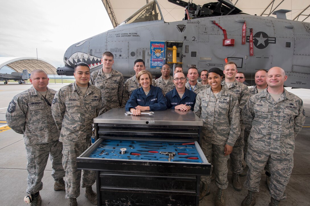 Airmen from the 23d Aircraft Maintenance Squadron (AMXS), pose for a photo with Col. Jennifer Short, 23d Wing (WG) commander and Chief Master Sergeant Jarrod Sebastian, 23d WG command chief, following an immersion tour, April 9, 2018, at Moody Air Force Base, Ga. Moody’s leadership toured the 23d AMXS to get a better understanding of their overall mission, capabilities, and comprehensive duties.  (U.S. Air Force photo by Airman Eugene Oliver)