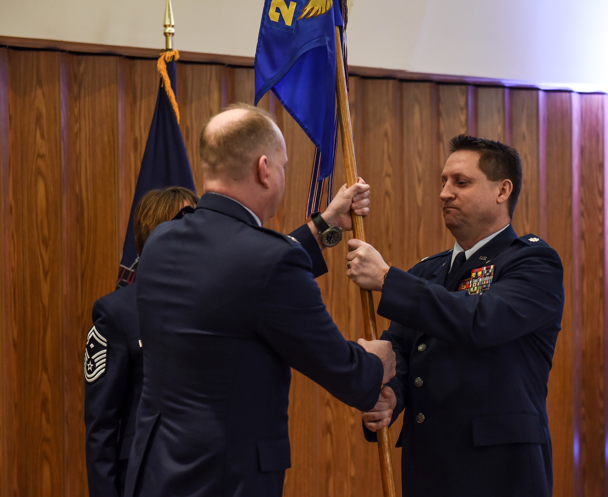 Col. Zdanavage passes the 201st RED HORSE Squadron guidon to Lt. Col. Mannion during the 201st RHS assumption of command.