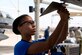 Airman 1st Class Makiah Green, 309th Aircraft Maintenance Unit weapons load crew member, attaches guidance fins onto an inert air-to-air missile during the 2018 1st Quarter Load Crew Competition at Luke Air Force Base, Ariz., April 6. Green and other members of her three-person team divided responsibilities and used high-stress communication techniques to load an aircraft with weapons as quickly and as safely as they could. (U.S. Air Force photo by Senior Airman Ridge Shan)