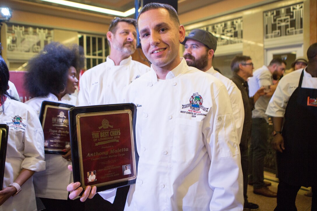 Staff Sgt. Anthony Maietta, an enlisted aide to Lt. Gen. Rex C. McMillian, commander of Marine Forces Reserve and Marine Forces North, poses for photo at the annual Best Chef Louisiana competition at the Lakefront Airport Terminal Building, New Orleans, April 10, 2018. Maietta competed in the competition for the opportunity to showcase the Marine Corps in the New Orleans community, himself and one of his signature dishes.