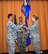 Lt. Col. Robyn Caudle accepts the 920th Aerospace Medicine Squadron (AMDS) guidon from Col. Ian Chase, 920th Rescue Wing vice commander during an assumption of command ceremony on Sunday, April 8 at Langley Air Force Base, Virginia.