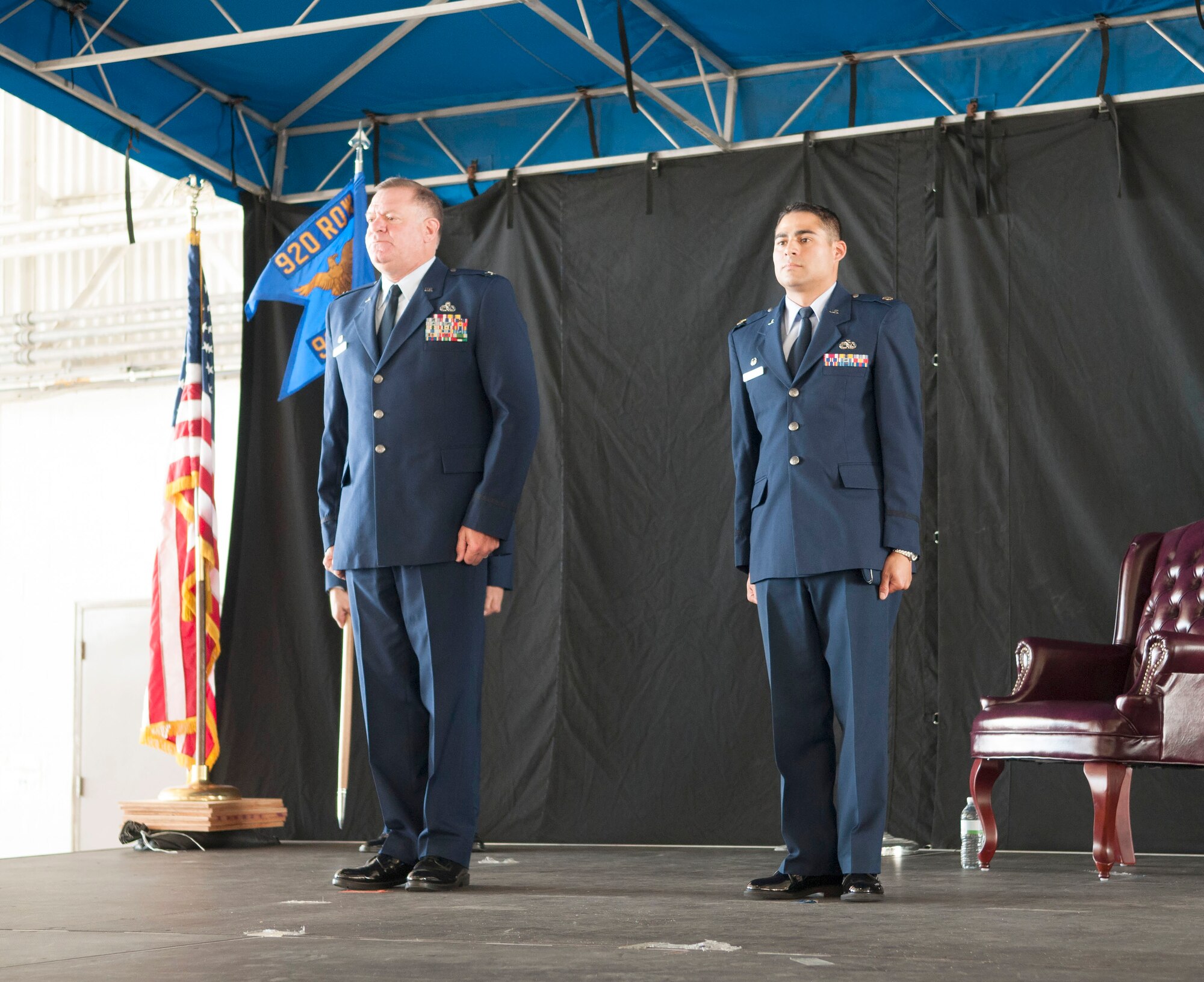 Col. Leo J. Kamphaus, Jr., commander of the 920th Maintenance Group and Maj. Chad P. Fuentes, commander of the 920th Aircraft Maintenance Squadron stand at attention during the 920th AMXS assumption of command ceremony.