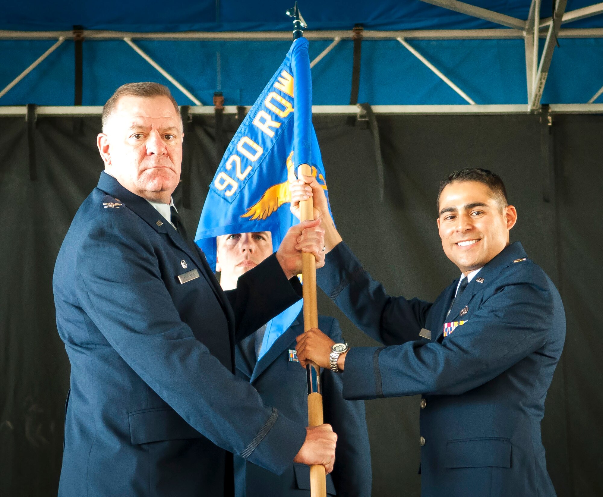 Col. Leo J. Kamphaus, Jr., commander of the 920th Maintenance Group and Maj. Chad P. Fuentes, commander of the 920th Aircraft Maintenance Squadron (AMXS) both hold the 920th Aircraft Maintenance Squadron guidon during the 920th AMXS assumption of command ceremony.