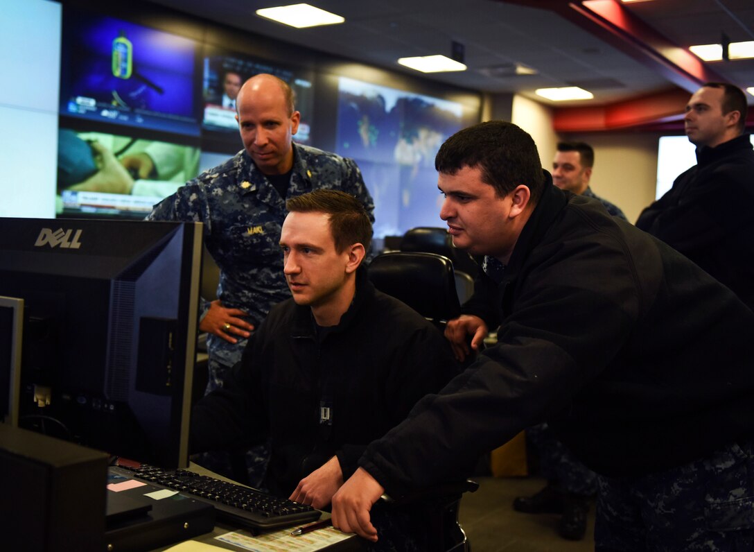 Sailors stand watch in the Fleet Operations Center at the headquarters of U.S. Fleet Cyber Command/U.S. 10th Fleet, Fort Meade, Maryland.
