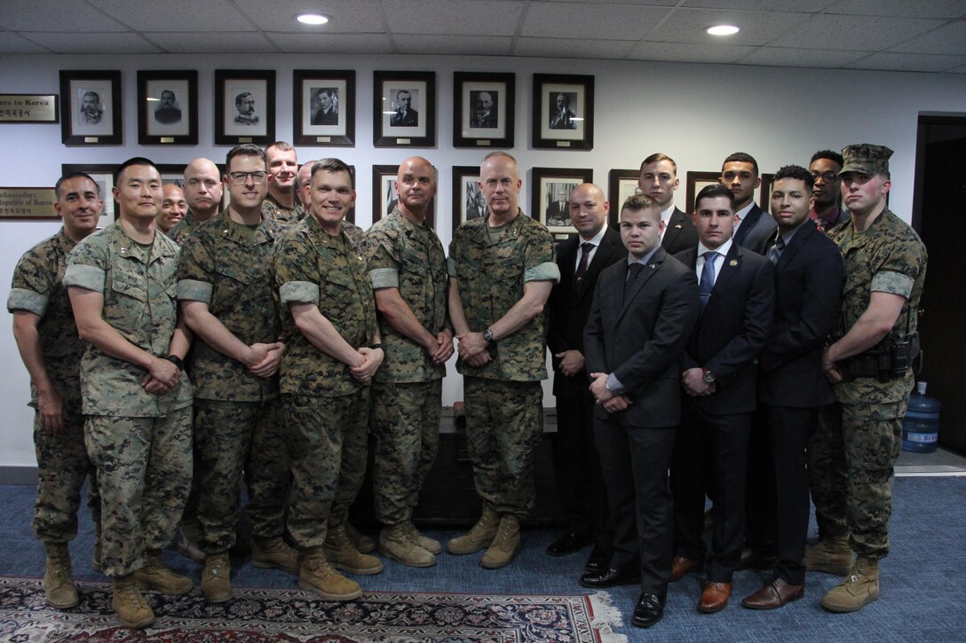 SEOUL, South Korea – Marines from U.S. Marine Corps Forces Korea visits the Republic of Korea U.S. Embassy Marine Corps detachment here, April 10. The wall behind the Marines displays portraits of every U.S. Ambassador at the embassy from the 19th Century through the present. (Official U.S. Marine Corps photo by Sgt. Nathaniel Hanscom/Released)