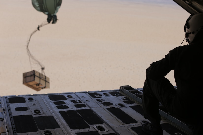 U.S. Marine Cpl. Lauren Song, an air crewman with Marine Aerial Refueler Transport Squadron 152, Marine Aircraft Group 12, 1st Marine Aircraft Wing, releases units of blood during an air delivery drop at Marine Corps Air Station Yuma, Ariz., March 28, 2018. There were five different packaging variations used for the air delivery. Each used materials from the Authorized Medical and Dental Allowance List and a special insulated box called a ‘Collins’ box; these variations also included numerous parachute configurations. The purpose of the exercise was to test the viability of blood samples being transported by air delivery.