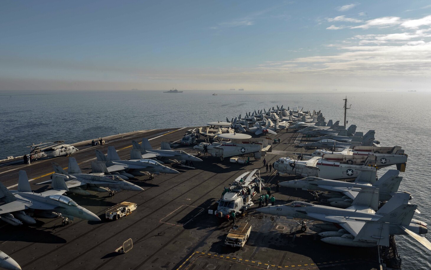 MANILA, Republic of the Philippines (April 11, 2018) The aircraft carrier USS Theodore Roosevelt (CVN 71) anchors off the coast of Manila, Republic of the Philippines for a scheduled port visit.  Theodore Roosevelt is deployed in the U.S. 7th Fleet area of operations in support of maritime security operations and theater security cooperation efforts.